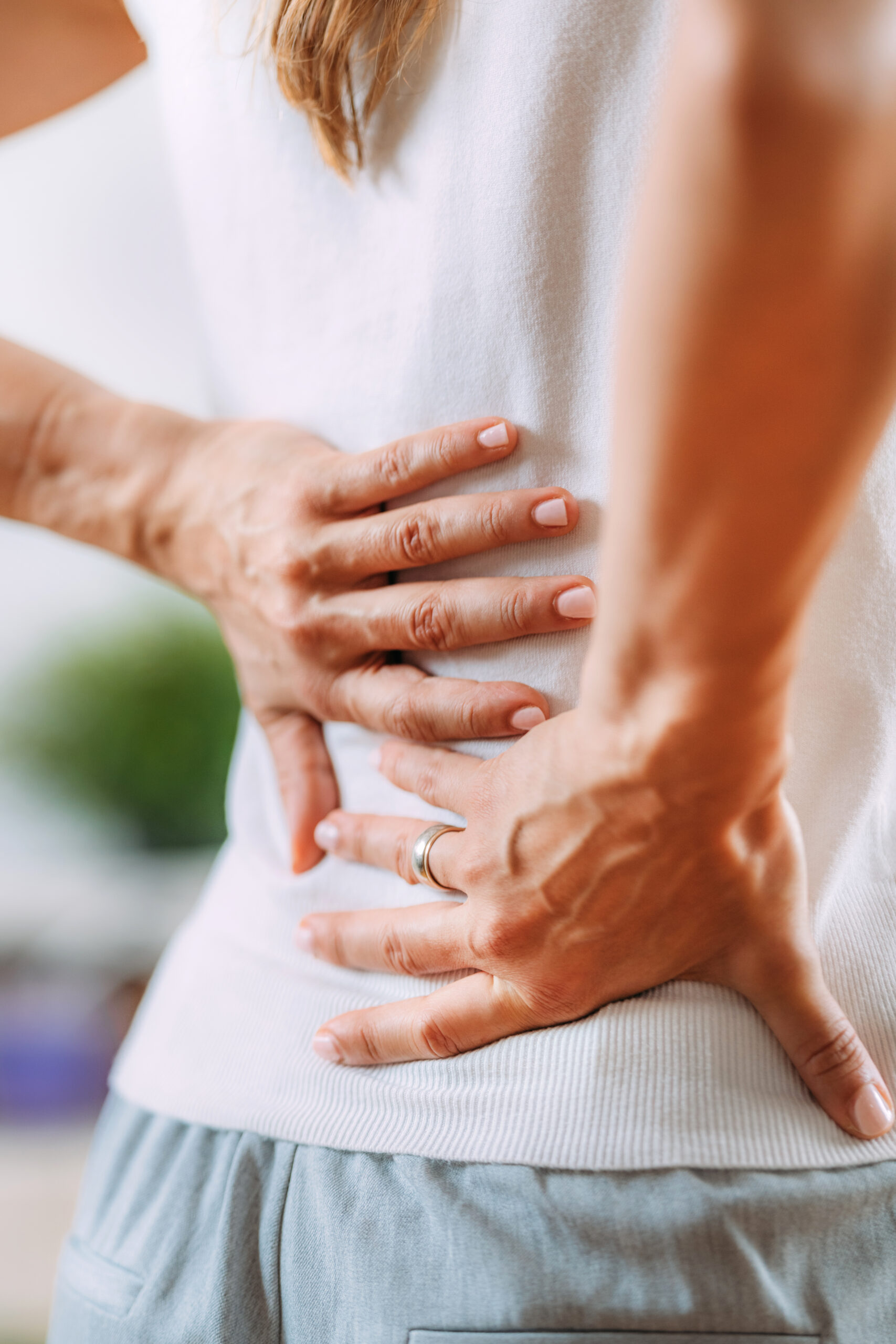 Woman with pain in lower back.